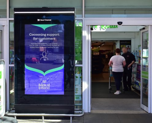 Digital screen at Asda store with Bank of Ireland cocooning campaign message